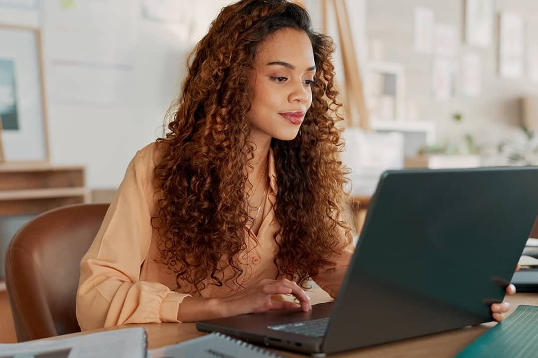 A businesswomen reviewing reports in the office.